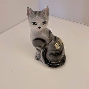 Ceramic, gray/black tabby cat figurine. Light green eyes and a pretty face!